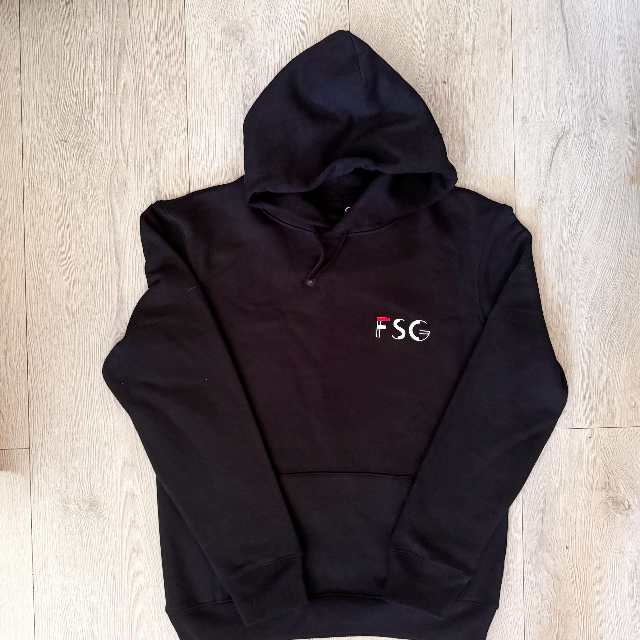 Custom black work hoodie with FSG company logo